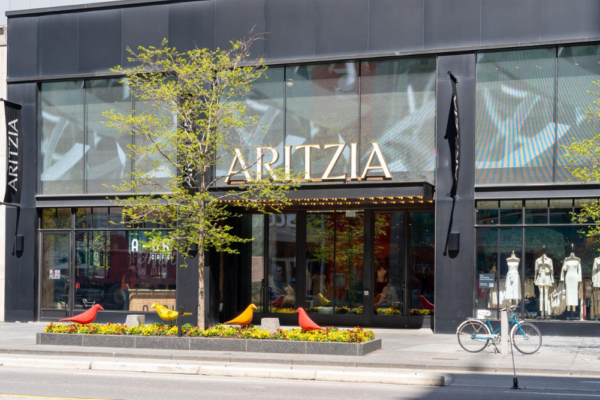 Exterior of an Aritzia fashion boutique with the brand's sign above the entrance.