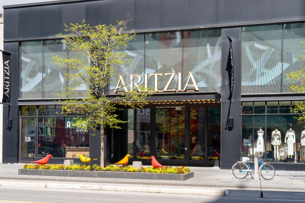 Exterior of an Aritzia fashion boutique with the brand's sign above the entrance.