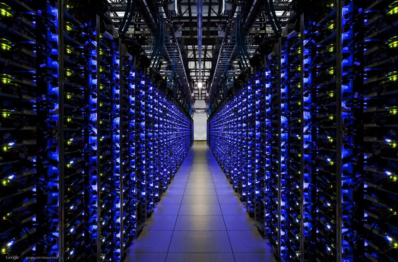 Rows of illuminated servers inside a data centre