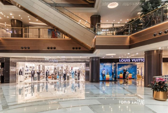 International luxury fashion stores inside an upscale shopping district in China.
