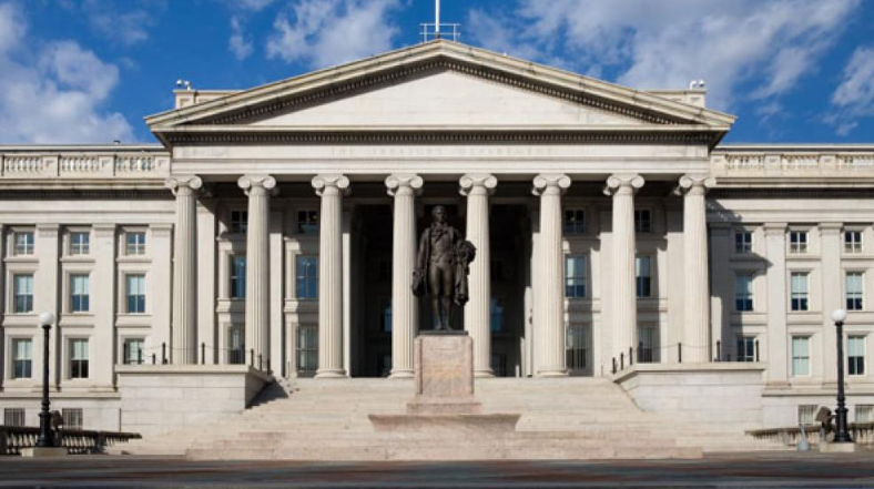 Exterior of the United States Treasury Department building in Washington, D.C., with its classical columns.