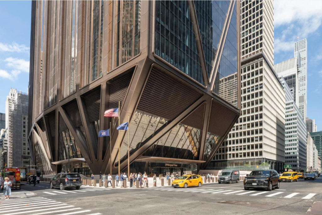 Modern JPMorgan Chase headquarters skyscraper in Midtown Manhattan, New York City, viewed from street level.