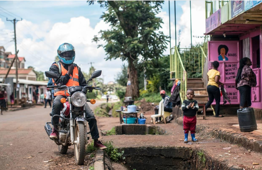 Delivery courier transporting online shopping orders on a motorcycle.