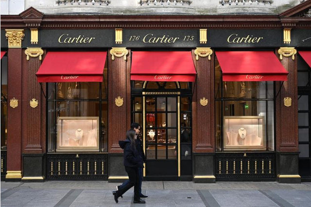 Cartier luxury jewelry boutique with illuminated display windows.
