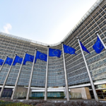 European Union flags outside the European Commission headquarters in Brussels.