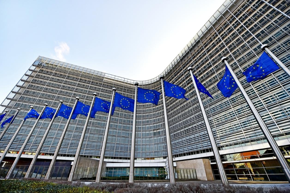 European Union flags outside the European Commission headquarters in Brussels.