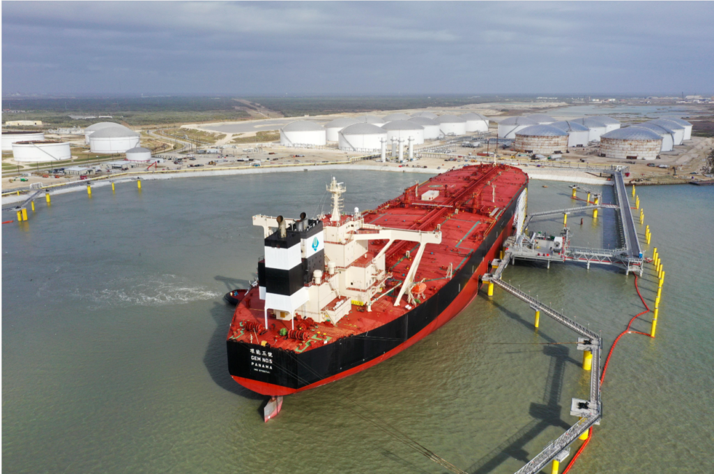 Oil tanker loading petroleum at a physical export terminal.