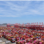 Container cranes and shipping containers at Yangshan Port near Shanghai, China.