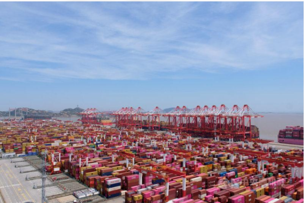 Container cranes and shipping containers at Yangshan Port near Shanghai, China.