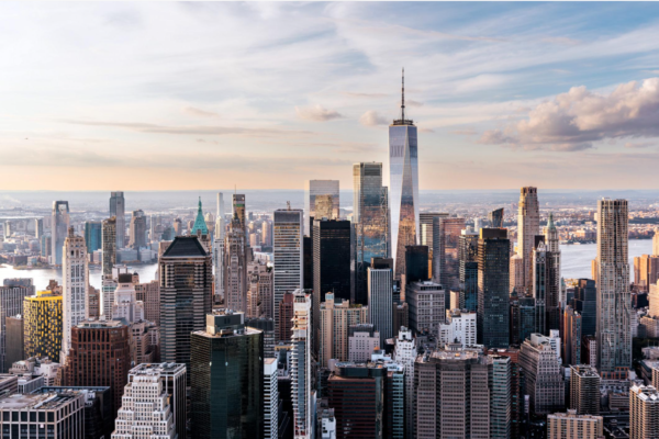 Manhattan's financial district skyline with office towers overlooking the waterfront.