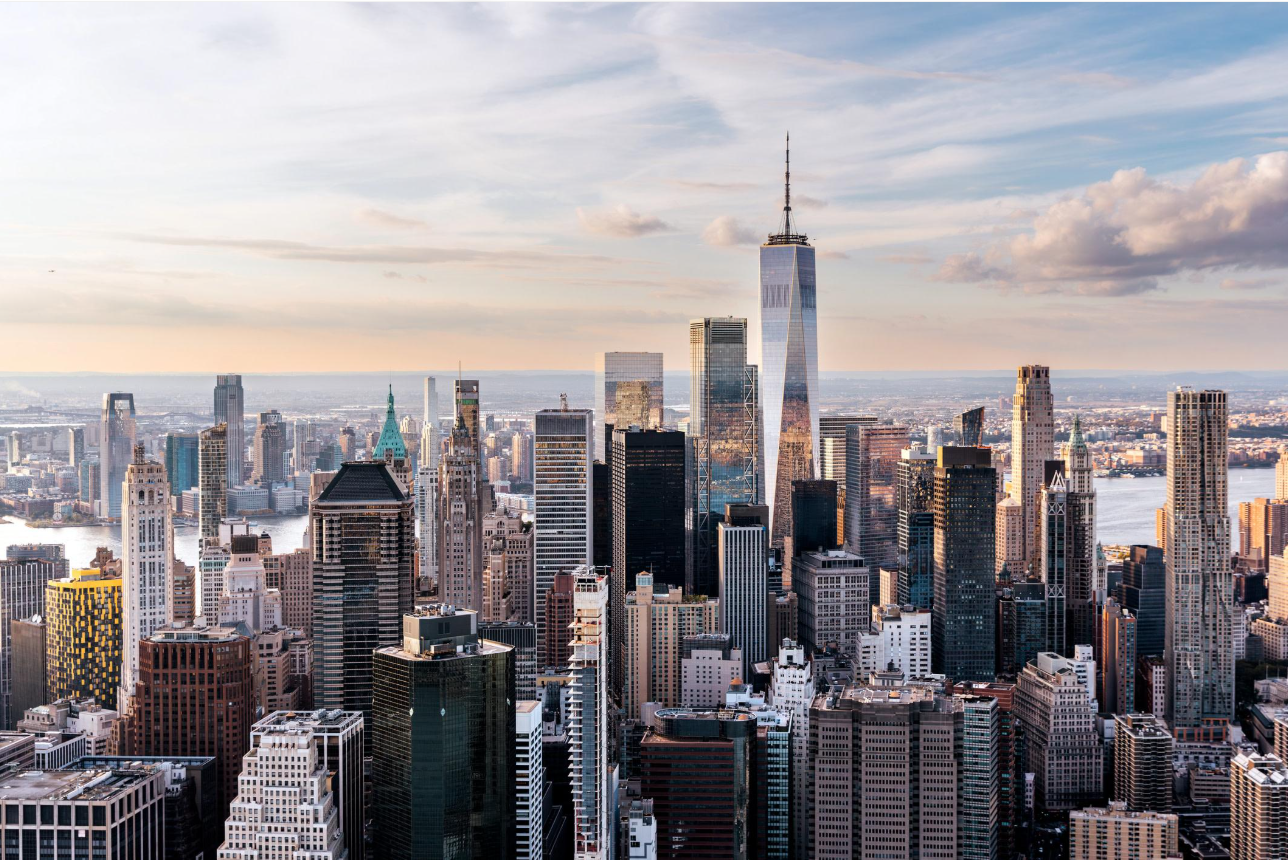 Manhattan's financial district skyline with office towers overlooking the waterfront.
