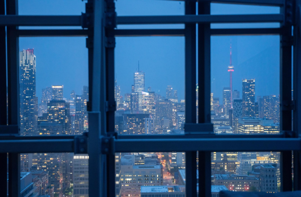 Office buildings in Toronto's financial district viewed through a window.
