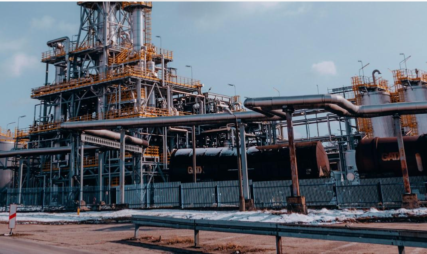 Petroleum refinery towers and industrial pipelines at a facility in Trzebinia, Poland