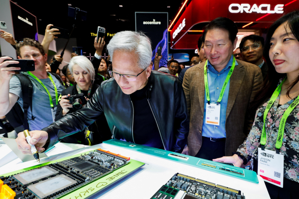 Jensen Huang presenting a large Nvidia AI computing system on stage.